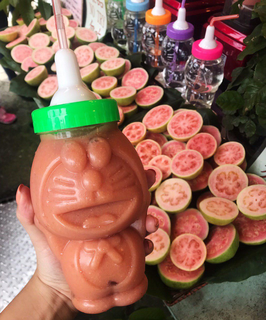 Freshly squeezed Guava Juice in Doraemon Bottle